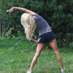 Victoria Silvstedt Stretches In A Park