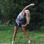 Victoria Silvstedt Stretches In A Park